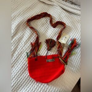 Cordo orange and multicolor Crossbody Bag with draw string closure. Never used.